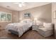 Serene bedroom with natural light, comfortable queen bed, and relaxing sitting area at 12050 N Panorama Dr # 104, Fountain Hills, AZ 85268