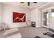 Well lit home gym with neutral walls, ceiling fan, and door to the exterior at 12050 N Panorama Dr # 104, Fountain Hills, AZ 85268