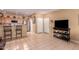 Spacious living room featuring tile floors, an open layout and convenient kitchen access, plus backyard access at 12050 N Panorama Dr # 104, Fountain Hills, AZ 85268