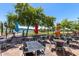 Charming outdoor patio featuring comfortable seating arrangements with views of the lake and clear sky at 12050 N Panorama Dr # 104, Fountain Hills, AZ 85268
