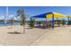 Community playground featuring colorful shade canopies and modern play equipment near the scenic lake and walking path at 12050 N Panorama Dr # 104, Fountain Hills, AZ 85268