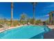 Beautiful community pool features clear blue water, surrounding lounge area, and desert landscaping at 12050 N Panorama Dr # 104, Fountain Hills, AZ 85268