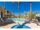 Resort style community pool and spa, surrounded by palm trees and lounge chairs, perfect for relaxing at 12050 N Panorama Dr # 104, Fountain Hills, AZ 85268