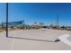 Outdoor basketball court ready for a game with scenic views, lush vegetation, and shady spots at 12117 W Luxton Ln, Avondale, AZ 85323