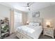 Bright bedroom features a ceiling fan, neutral colors, and natural light at 12117 W Luxton Ln, Avondale, AZ 85323