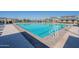 Large community pool with lane markers and easy access steps for a refreshing experience at 12117 W Luxton Ln, Avondale, AZ 85323
