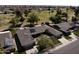Bird's-eye view of the home with solar panels and a well-kept lawn at 12822 W Ballad Dr, Sun City West, AZ 85375
