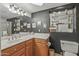 Modern bathroom with vanity, mirror, and open shelving for storage at 12822 W Ballad Dr, Sun City West, AZ 85375