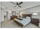 Bedroom featuring neutral colors, a ceiling fan, and side tables on both sides at 12822 W Ballad Dr, Sun City West, AZ 85375