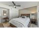 Comfortable bedroom features a ceiling fan and neutral tones at 12822 W Ballad Dr, Sun City West, AZ 85375