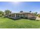 Well-maintained home with a covered patio and manicured lawn at 12822 W Ballad Dr, Sun City West, AZ 85375