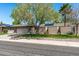 Beautiful home featuring desert landscaping, mature trees, solar panels and a wide driveway at 12822 W Ballad Dr, Sun City West, AZ 85375