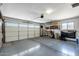 Spacious garage with storage shelving and ample space at 12822 W Ballad Dr, Sun City West, AZ 85375