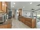 Well-equipped kitchen featuring stainless steel appliances, granite countertops, and a functional layout for cooking at 12822 W Ballad Dr, Sun City West, AZ 85375