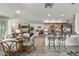 Open concept kitchen and dining area with stainless appliances and a view to the living room at 12822 W Ballad Dr, Sun City West, AZ 85375
