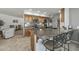 Kitchen featuring stainless steel appliances, granite counters, tile backsplash, and seating at the counter at 12822 W Ballad Dr, Sun City West, AZ 85375