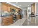 Modern kitchen with stainless steel appliances, granite countertops, and ample cabinet space for storage at 12822 W Ballad Dr, Sun City West, AZ 85375