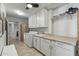 Functional laundry area featuring ample storage cabinets and sink at 12822 W Ballad Dr, Sun City West, AZ 85375