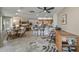 Bright open-concept living area with modern kitchen, dining space, and comfortable seating at 12822 W Ballad Dr, Sun City West, AZ 85375