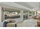 Enclosed patio featuring comfortable seating, sliding glass doors, and golf course views at 12822 W Ballad Dr, Sun City West, AZ 85375