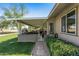 Spacious covered patio with a built-in grill and ample seating for outdoor entertaining at 12822 W Ballad Dr, Sun City West, AZ 85375