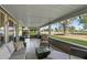 Relaxing covered patio with comfortable outdoor furniture and views of the golf course at 12822 W Ballad Dr, Sun City West, AZ 85375