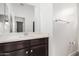 Bathroom with a modern vanity, a large mirror, and a neutral color palette at 14254 W Honeysuckle Dr, Surprise, AZ 85387