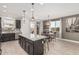 Gourmet kitchen area leading to a dining space and outdoor access for seamless entertaining at 14254 W Honeysuckle Dr, Surprise, AZ 85387