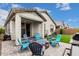 Cozy covered patio with fire pit and ample seating, perfect for outdoor entertaining at 14254 W Honeysuckle Dr, Surprise, AZ 85387