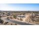 An aerial perspective of a home, with desert landscapes surrounded by mountain views in the distance at 15001 W Camdon Dr, Casa Grande, AZ 85194