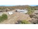 Aerial view of the property highlighting the home, shed, and surrounding landscape at 15001 W Camdon Dr, Casa Grande, AZ 85194