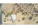An aerial view showcases the property's layout, complete with a cozy residence and desert setting at 15001 W Camdon Dr, Casa Grande, AZ 85194