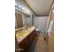 Well-lit bathroom featuring a double sink vanity and a shower-tub combo at 15001 W Camdon Dr, Casa Grande, AZ 85194