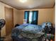 Inviting bedroom featuring a comfortable bed with modern bedding and serene decor at 15001 W Camdon Dr, Casa Grande, AZ 85194