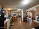 Functional kitchen with wood cabinets, a black refrigerator, and a view to the living area at 15001 W Camdon Dr, Casa Grande, AZ 85194