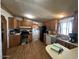 Functional kitchen with wood cabinets, stainless steel appliances, and hardwood flooring at 15001 W Camdon Dr, Casa Grande, AZ 85194