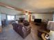 Spacious living room with fireplace, comfortable seating, and a large flat screen tv at 15001 W Camdon Dr, Casa Grande, AZ 85194
