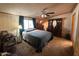 Bedroom featuring carpet, a ceiling fan, and a dresser at 15001 W Camdon Dr, Casa Grande, AZ 85194