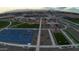Aerial view of the community park, featuring basketball and cornhole courts at 15660 W Deanne Dr, Waddell, AZ 85355
