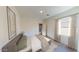 Bright bedroom with neutral tones, closet, and large window at 15660 W Deanne Dr, Waddell, AZ 85355
