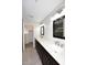 Bathroom featuring dual sinks, quartz countertops, dark cabinets and a walk-in closet at 1966 E Pebble Beach Dr, Tempe, AZ 85282