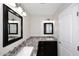 Bathroom with granite countertop, modern lighting, dual sinks, and cabinetry at 1966 E Pebble Beach Dr, Tempe, AZ 85282