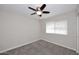 Bedroom features neutral carpeting, ceiling fan, and a window at 1966 E Pebble Beach Dr, Tempe, AZ 85282