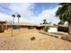 Attractive single-story home with a well-maintained desert landscape and classic brick exterior at 1966 E Pebble Beach Dr, Tempe, AZ 85282