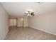 Open living room with neutral walls, tile flooring, and a ceiling fan creating a comfortable atmosphere at 1966 E Pebble Beach Dr, Tempe, AZ 85282