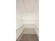 Walk-in pantry with ample shelving space for food storage and organization, complemented by neutral walls at 1966 E Pebble Beach Dr, Tempe, AZ 85282