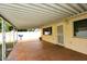 Covered patio space with tile flooring and outdoor access at 1966 E Pebble Beach Dr, Tempe, AZ 85282