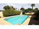Backyard pool featuring mature trees and landscaping at 1966 E Pebble Beach Dr, Tempe, AZ 85282