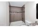 Gray tiled shower-tub combination and granite countertop at 1966 E Pebble Beach Dr, Tempe, AZ 85282