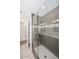 Modern bathroom shower with glass door and decorative gray tile at 1966 E Pebble Beach Dr, Tempe, AZ 85282